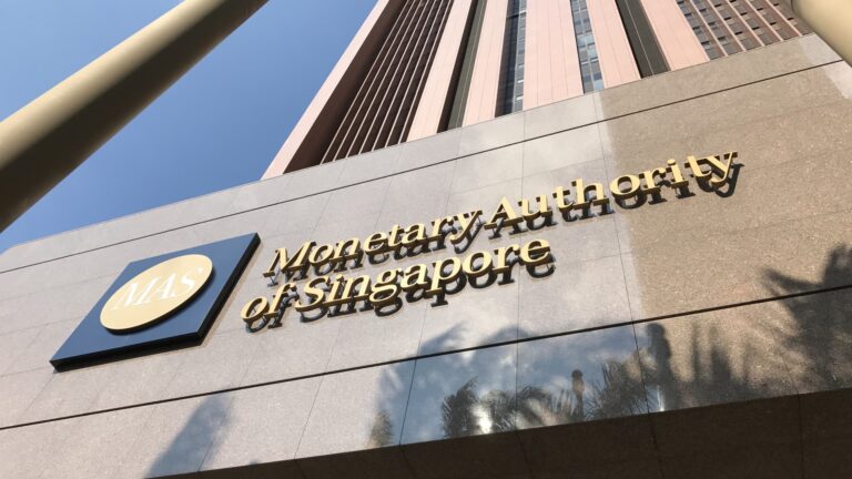 Singapore eases monetary policy for a second straight time as city-state cuts growth forecast