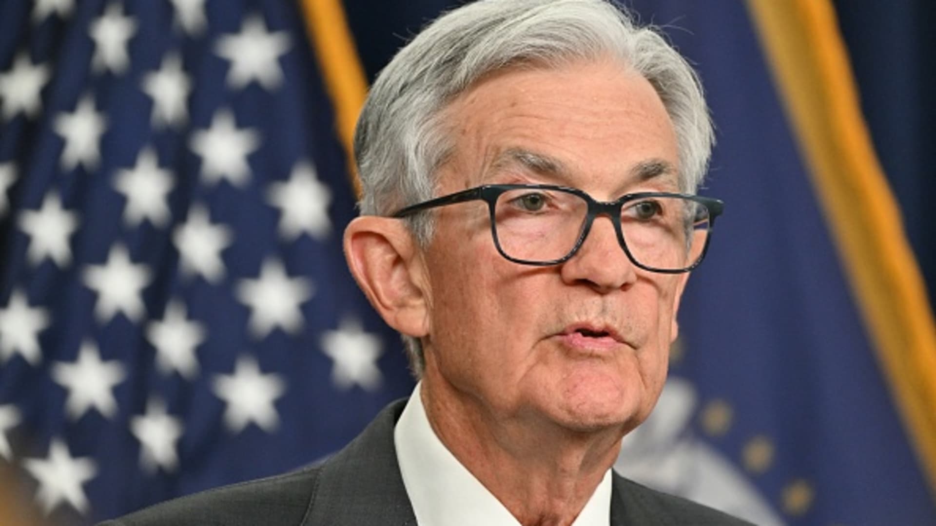 Powell sees tariffs raising inflation and says Fed will wait before further rate moves