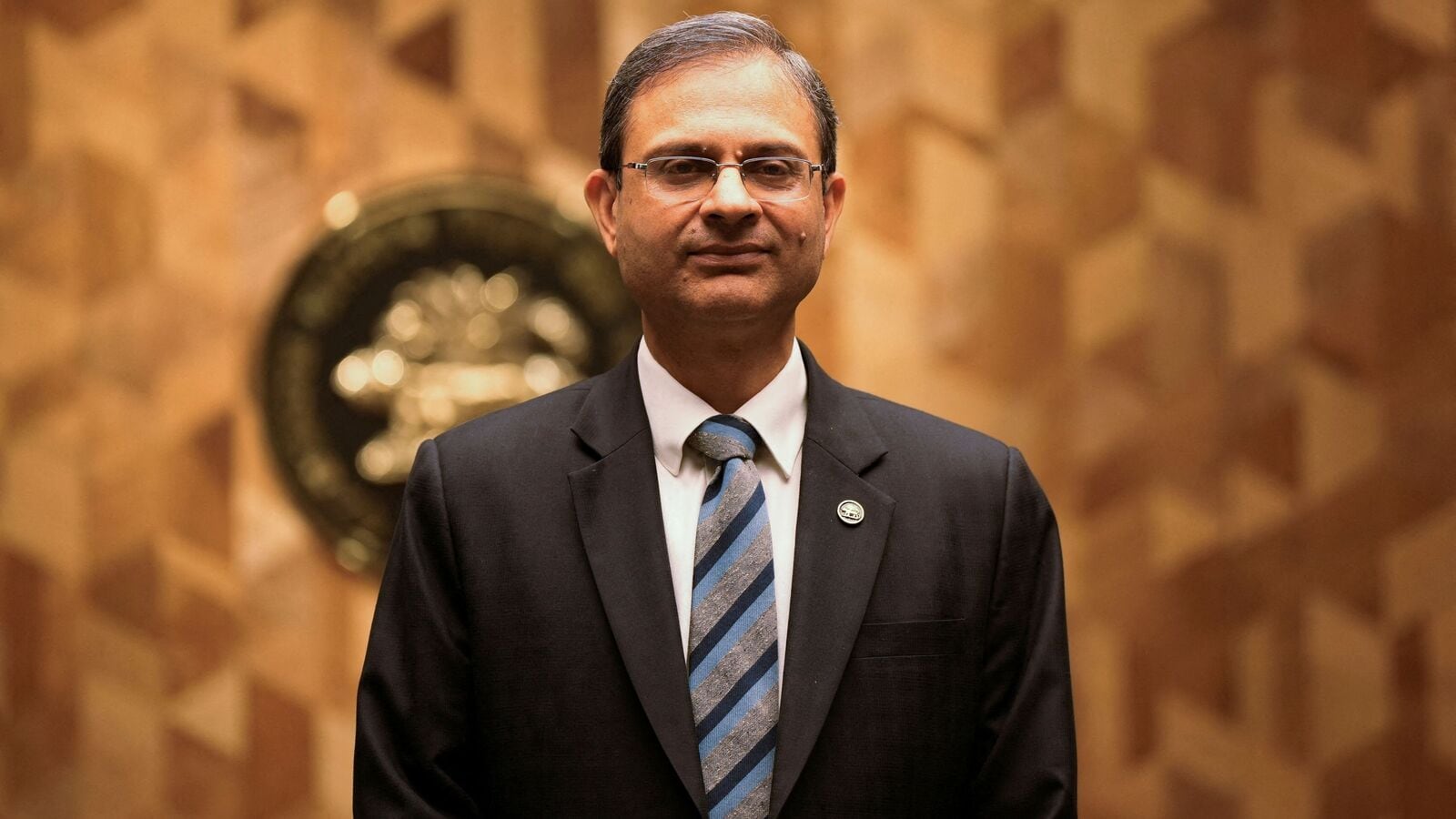 Rate-sensitive sectors fall even as RBI cuts rate, shifts stance; Realty and PSU indices tank 2.8%, Nifty Bank down 1%