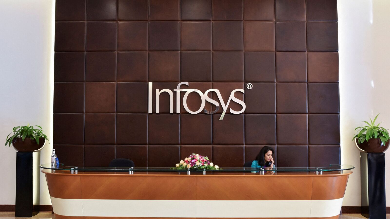 Infosys share price gains despite reporting 12% YoY decline in net profit; Should you buy, sell or hold? | Stock Market News