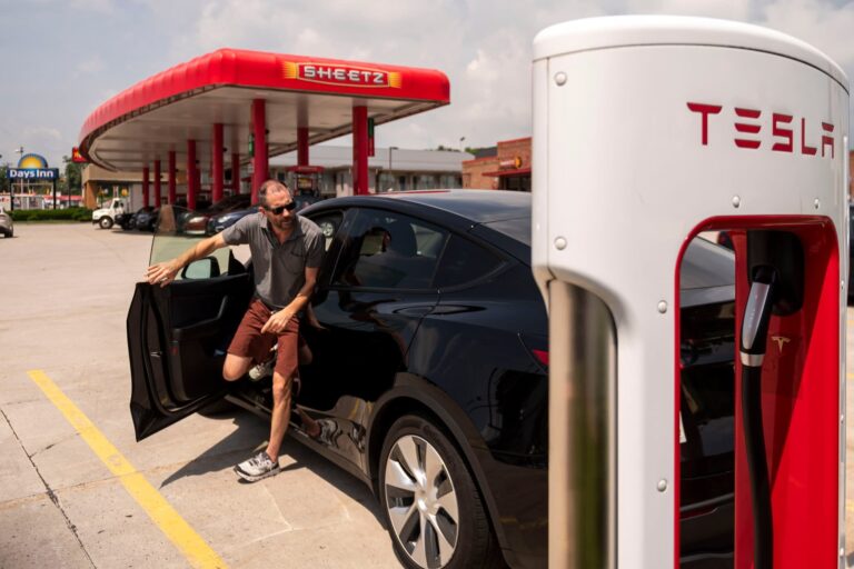 A driver stops to charge a Tesla vehicle at a Sheetz gas station in Breezewood, Pennsylvania, US