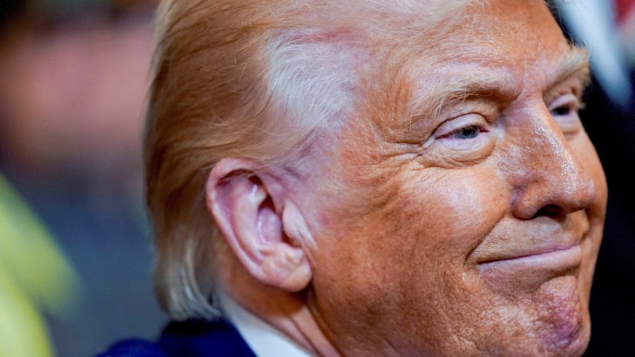 Trump defies market tumult and pushes ahead with trade war