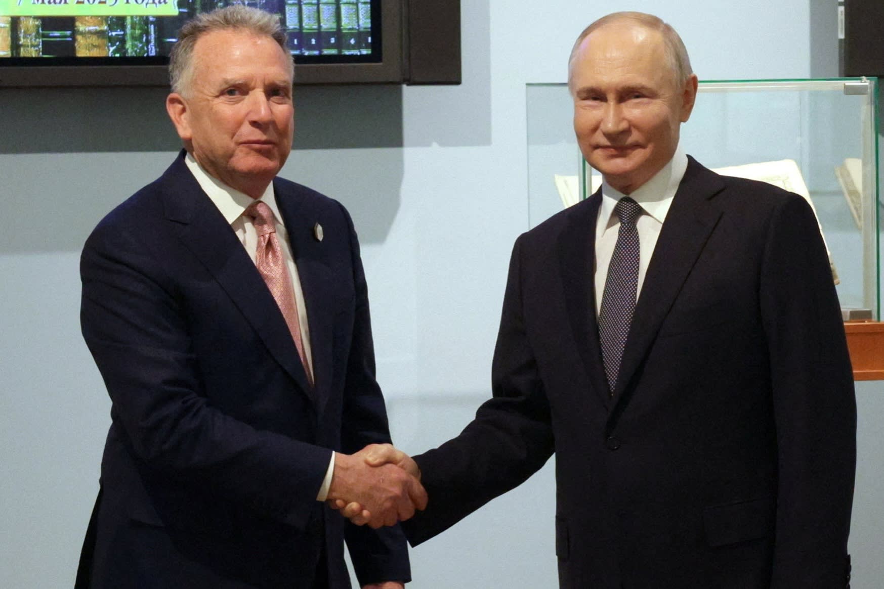 Russian President Vladimir Putin shakes hands with US special envoy Steve Witkoff