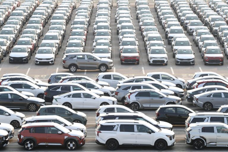 Vehicles produced by South Korean automaker Kia Motors are lined up ready to be shipped at the company’s shipping yard at the Port of Pyeongtaek