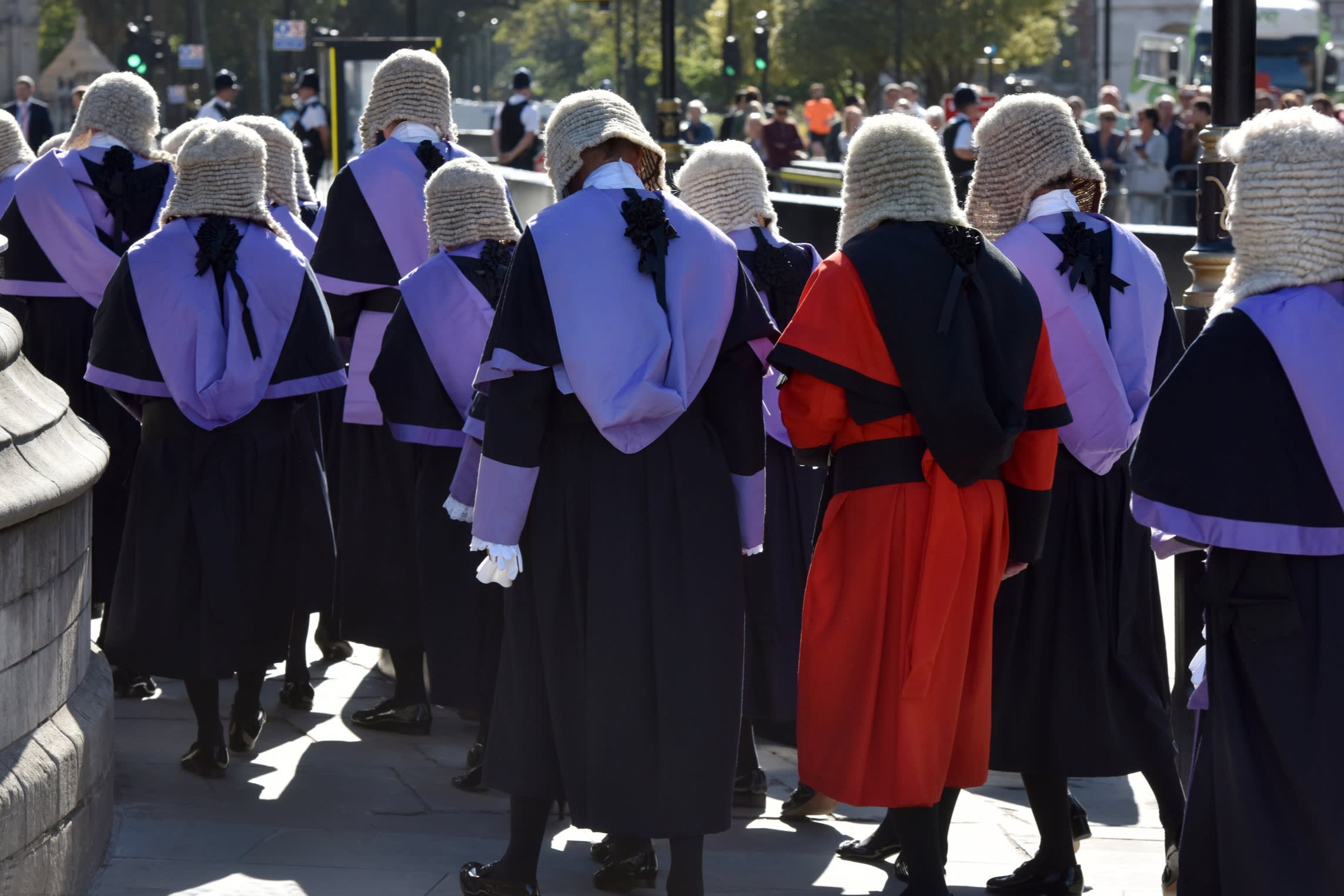 High court and circuit judges in full wigs and ceremonial robes during a procession in Westminster at the start of the legal year