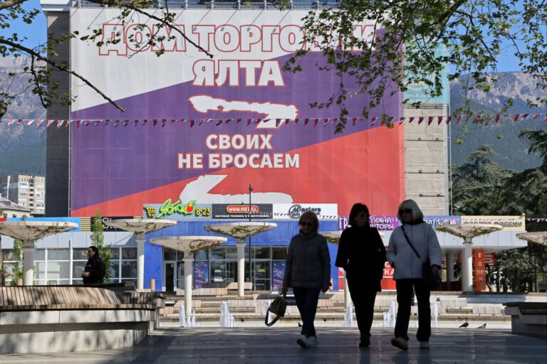 A banner in Crimea in the colours of the Russian flag reads ‘We don’t abandon our people’