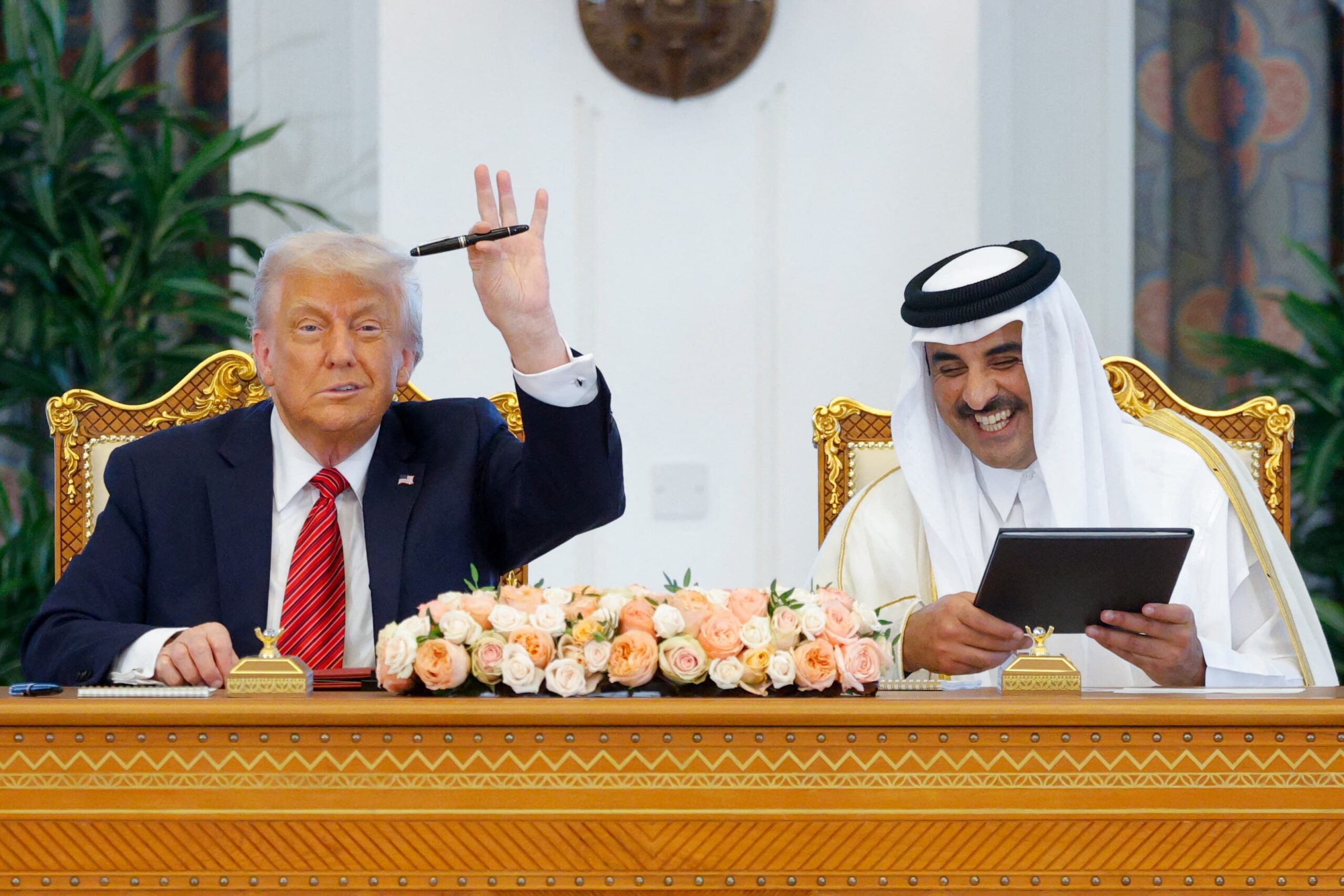 U.S. President Donald Trump and Qatar's Emir Tamim bin Hamad Al Thani meet in Doha, Qatar, on May 14, 2025.