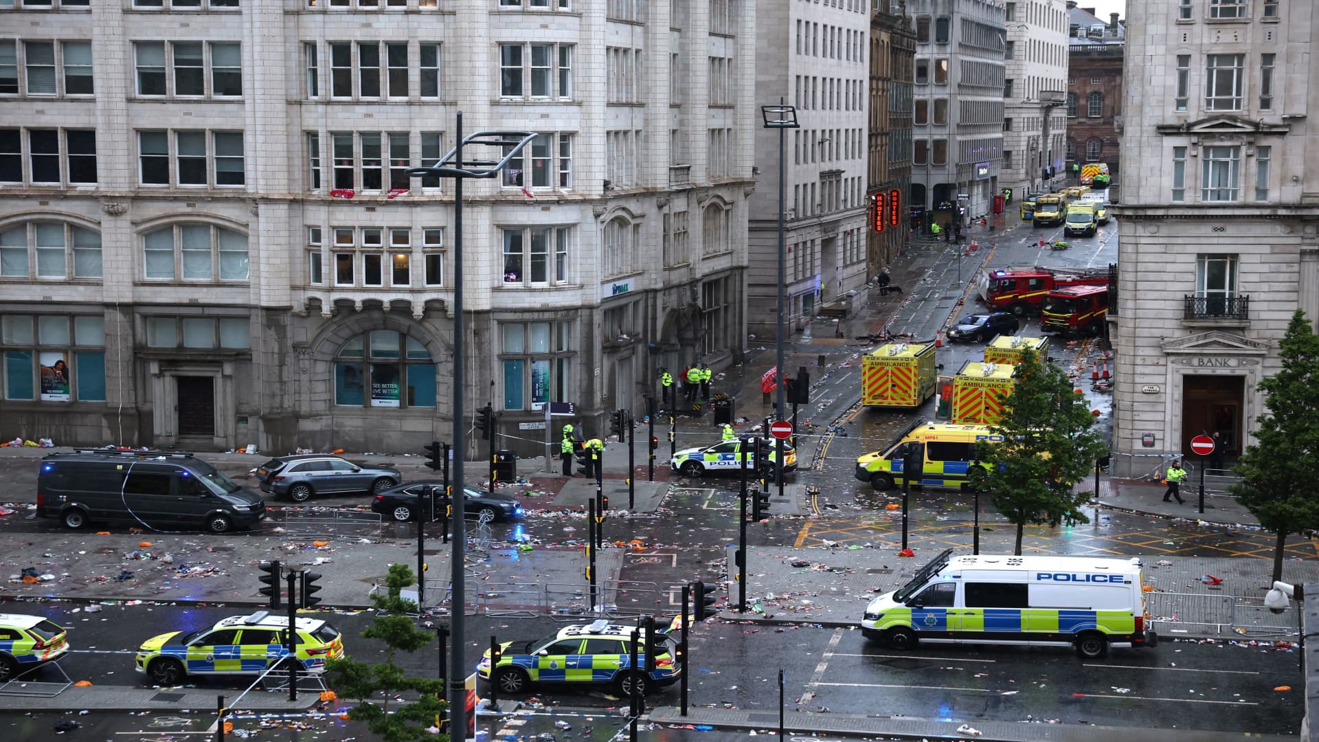 Car collides with pedestrians at parade celebrating soccer win in Liverpool, England