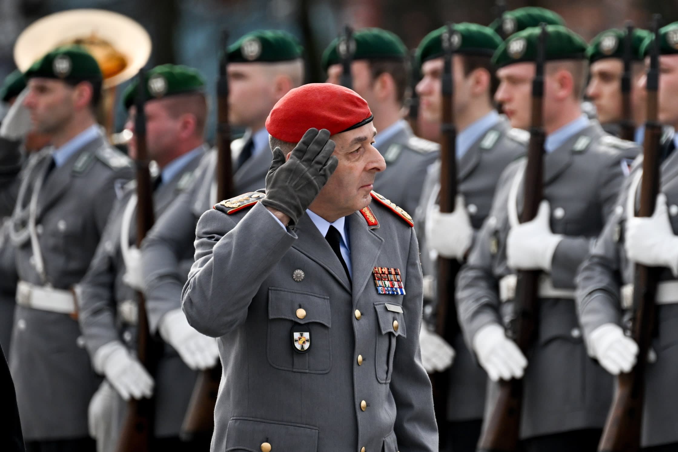 Carsten Breuer saluting soldiers
