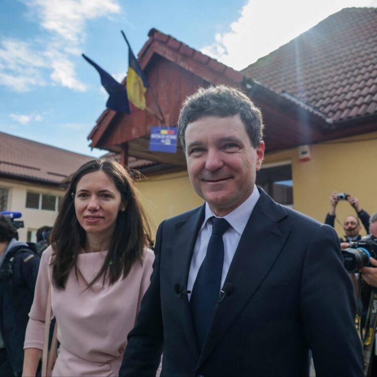 Nicușor Dan and his partner, Mirabela Grãdinaru, leave a polling station in Făgăraș on Sunday