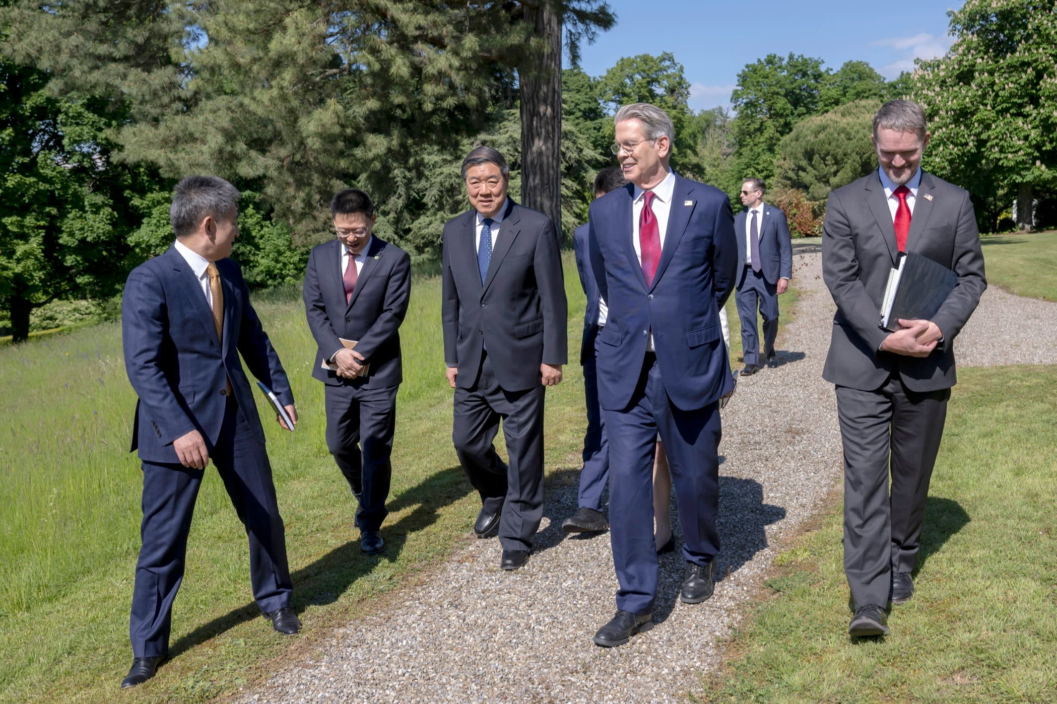 Bessent and He walking in a park with other officials