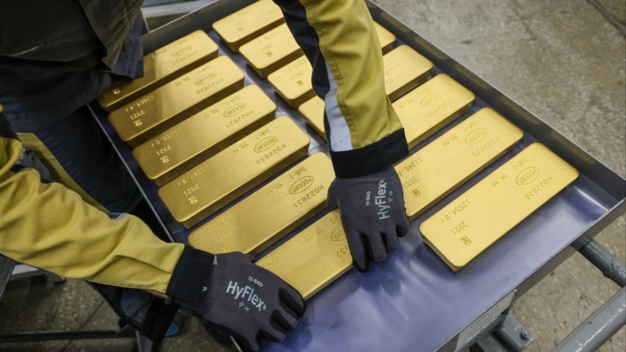 Gold sells off amid reports of trade talks progress