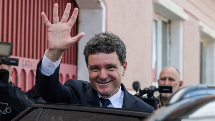 Romanian centrist ahead in presidential race, exit polls show