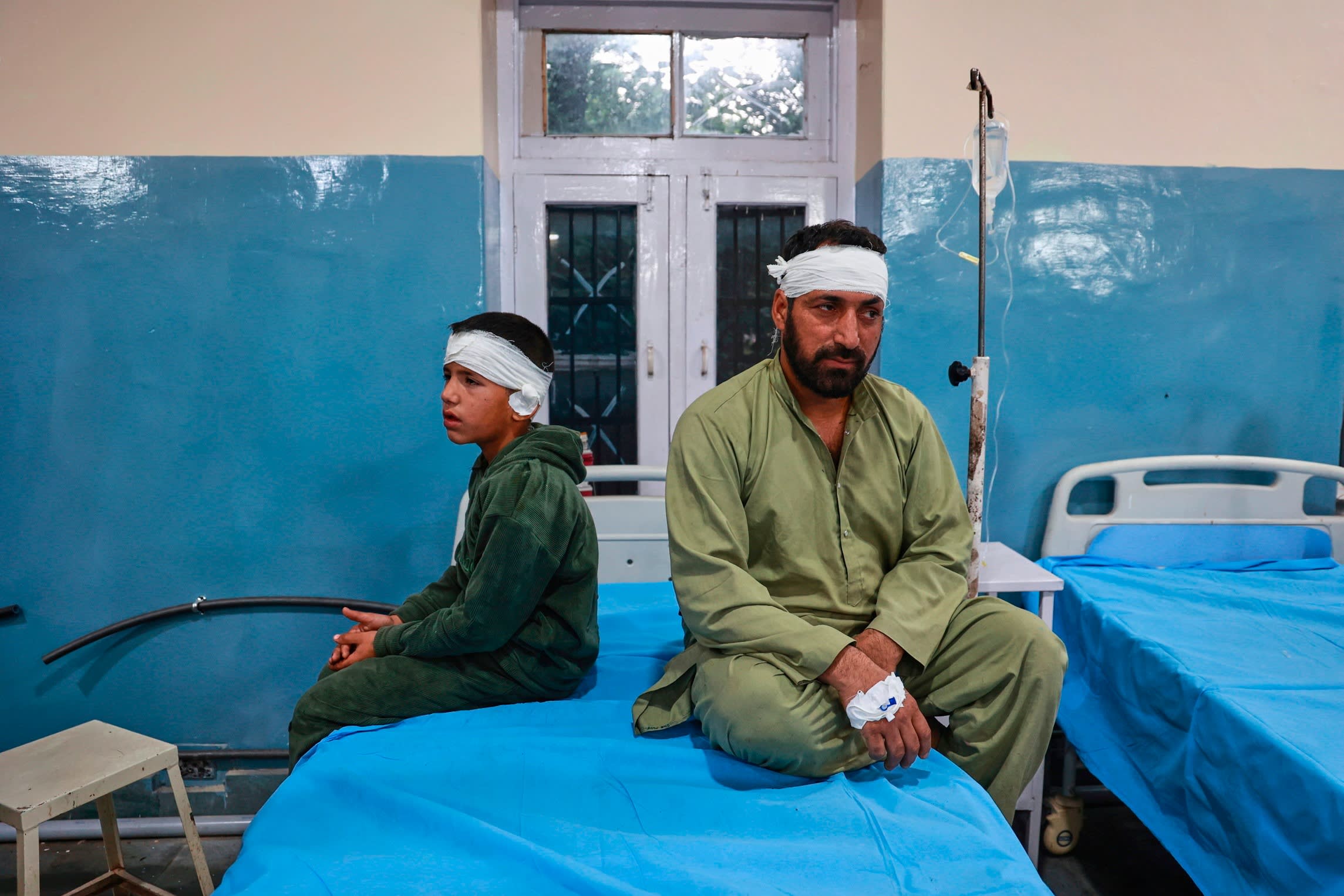 A father and a son who live in a village near the Line of control between India and Pakistan and got injured in Pakistani shelling get treated in a hospital in Uri,