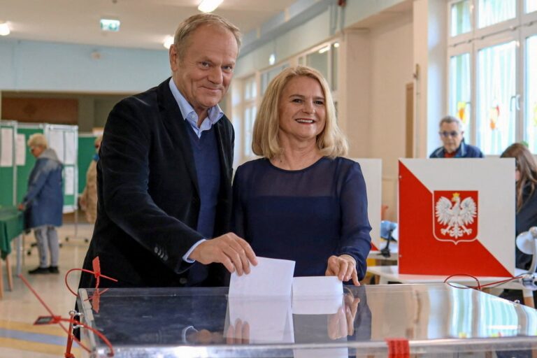 Polish Prime Minister Donald Tusk and his wife Malgorzata vote during the first round of the presidential election