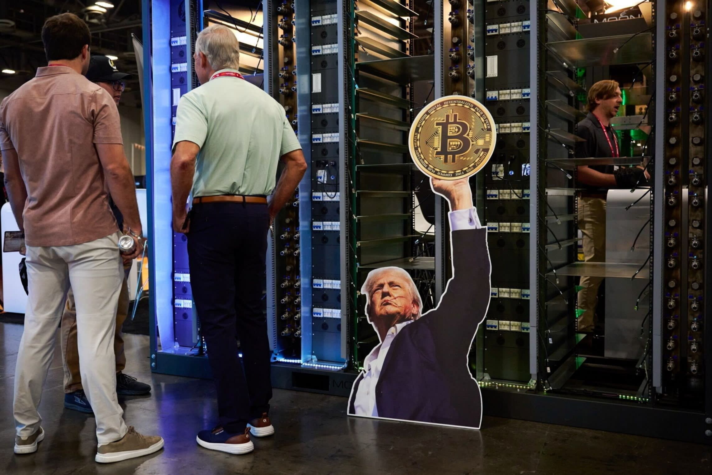 A cutout of US President Donald Trump holding a Bitcoin token at the Moonshots booth during the Bitcoin 2025 conference