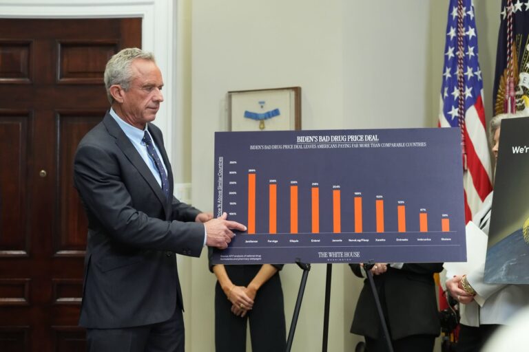 Robert F Kennedy Jr points to a chart during a press conference
