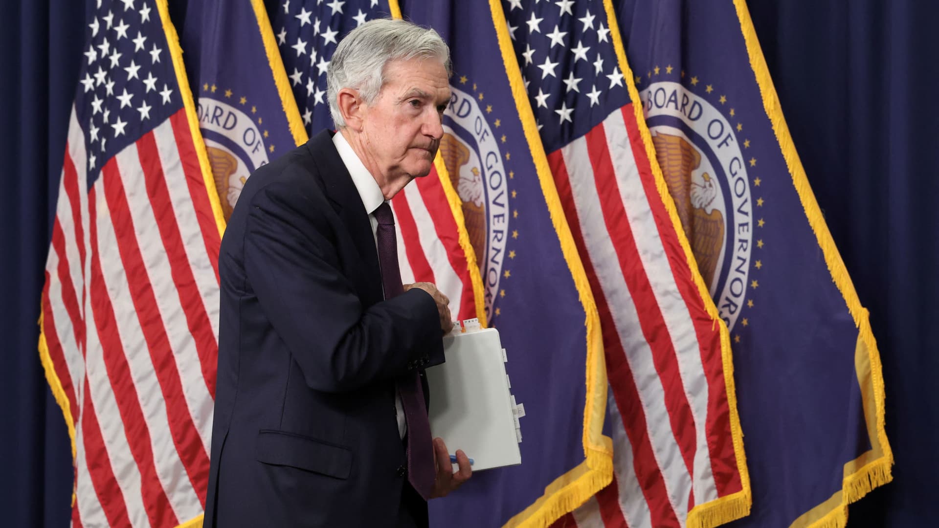 Fed holds key rate steady, still sees two more cuts this year