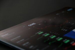 laptop stock chart image on dark background
