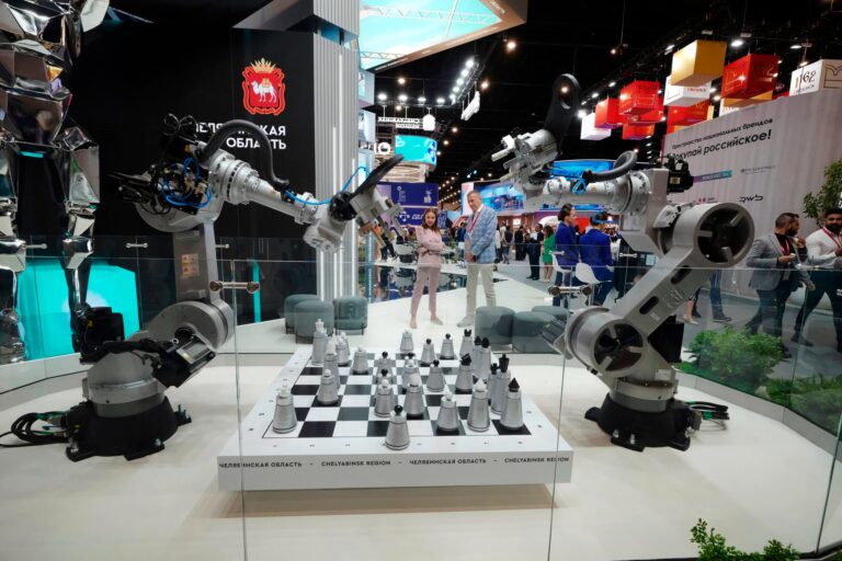 Visitors look at an exhibition on the sidelines of the St Petersburg International Economic Forum