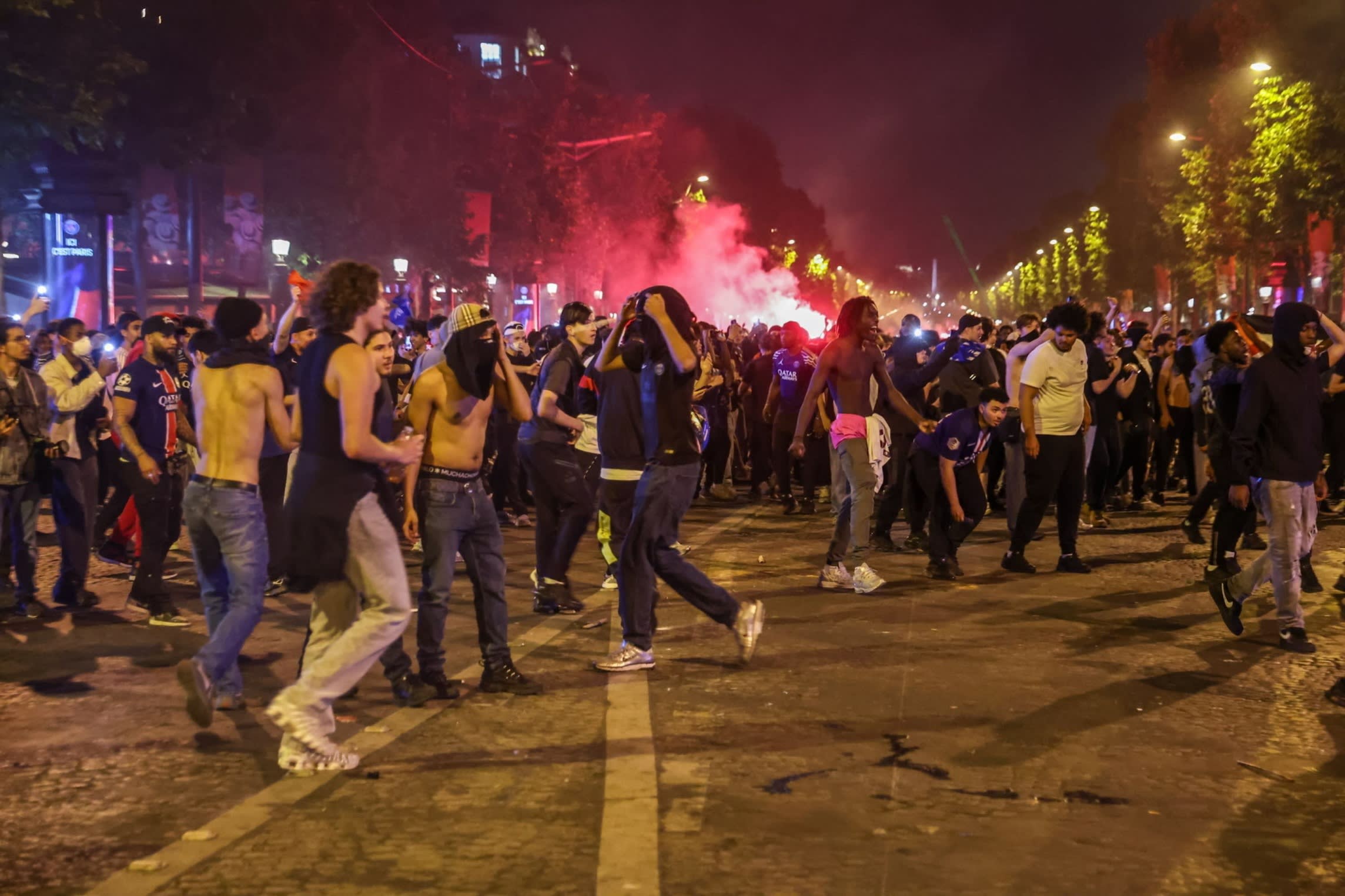 PSG fans celebrating Champions League victory on the Champs-Élysées on Saturday