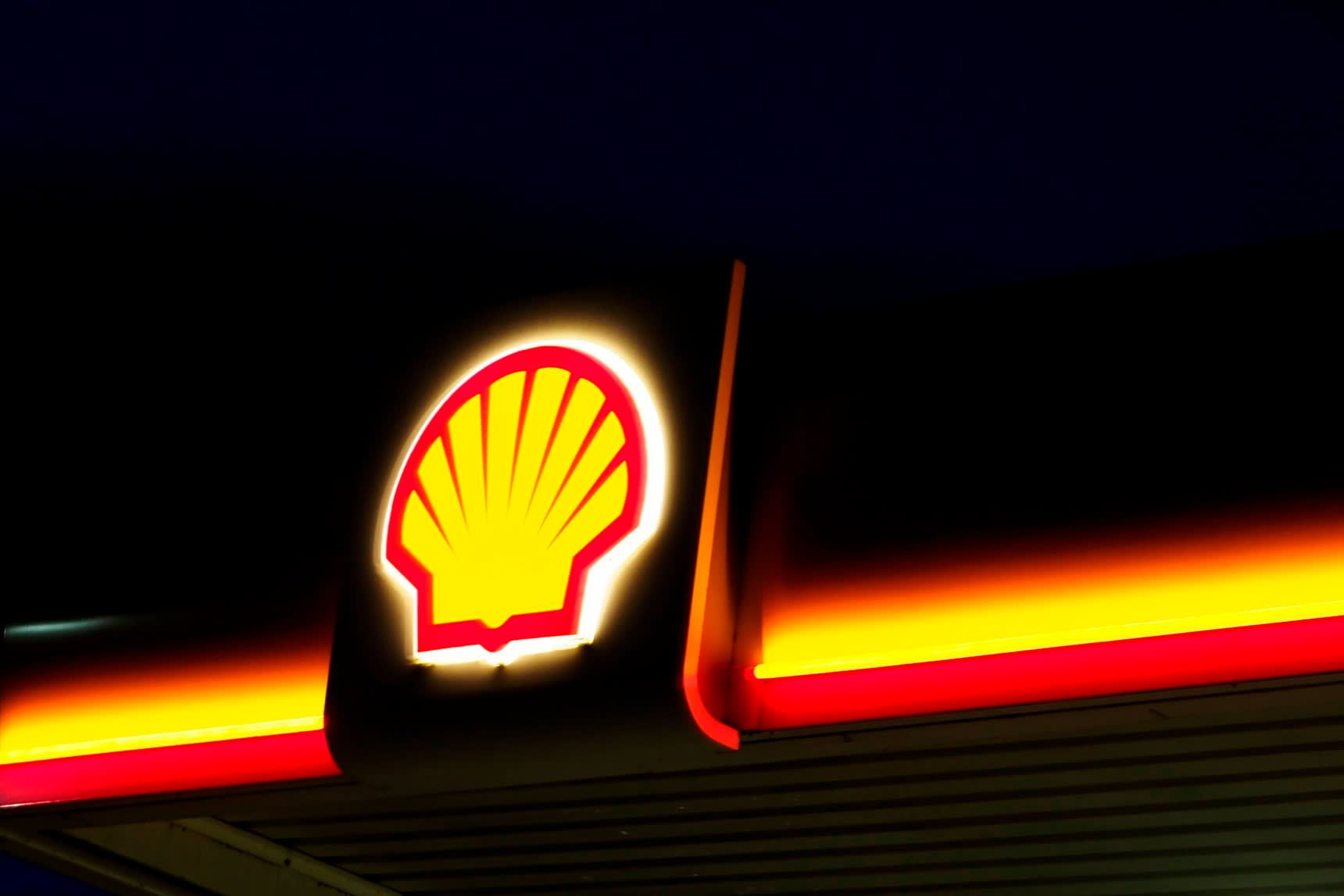 The Shell logo glowing at night