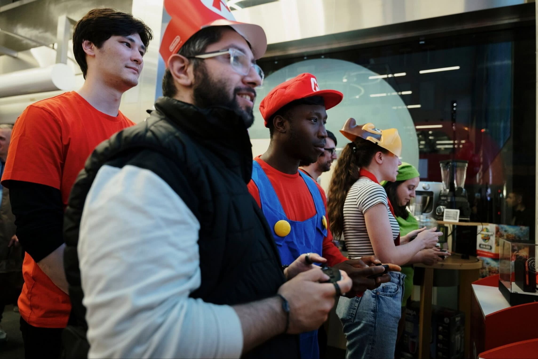 Customers in a London electronics store play the new Mario Kart video game released to coincide with the launch of the Switch 2