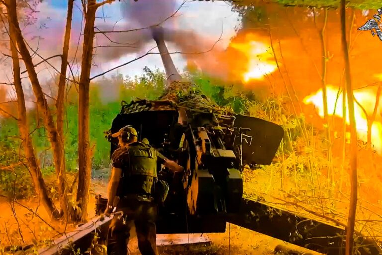 Russian troops firing towards a Ukrainian position near the border area of the Kursk region