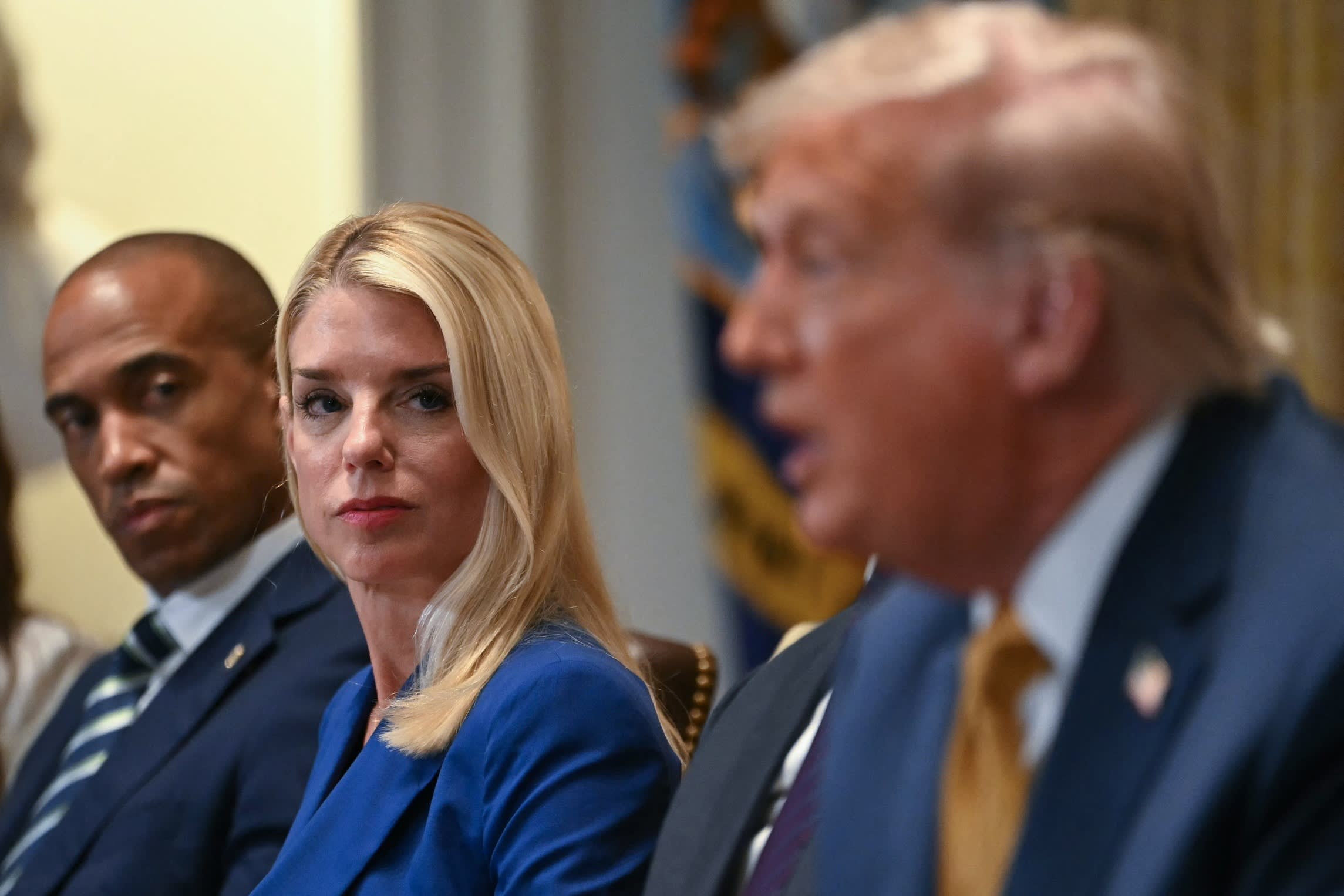 Attorney-general Pam Bondi (centre) look on as President Donald Trump speaks during a meeting in the Cabinet Room of the White House in Washington, DC, on July 8