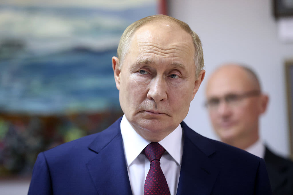 Russian President Vladimir Putin (L) observes an exhibition as Presidential Deputy Chief of Staff Sergey Kiriyenko (Kirienko) (R) looks on while visiting the All-Russian Scientific Research Institute Of Experimental Physics on August 22, 2025 in Sarov, Russia.