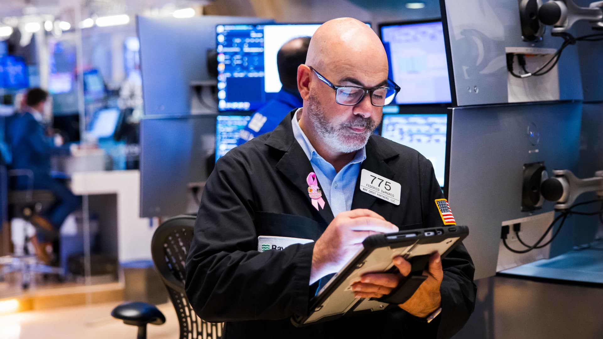 Pro traders are watching Pfizer after a big move last week and two other stocks with earnings on deck