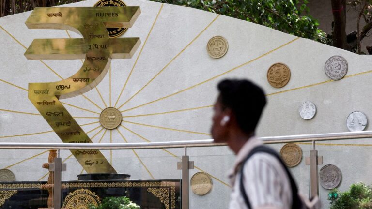 Rupee slips to record low of  92.00 against US dollar. Where is INR headed now? | Stock Market News