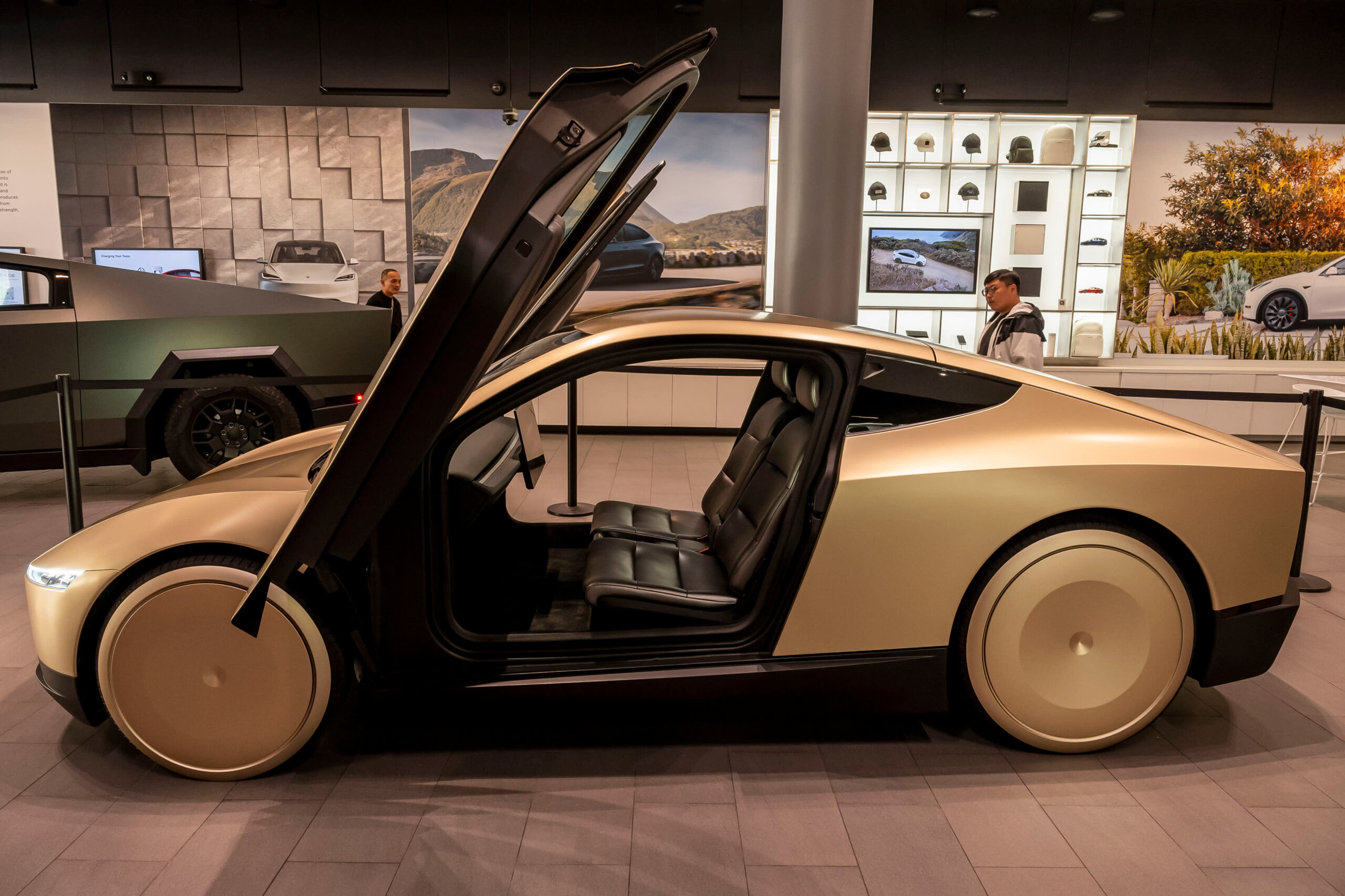 Why investors are divided on Tesla's turn to robots and self-driving cars