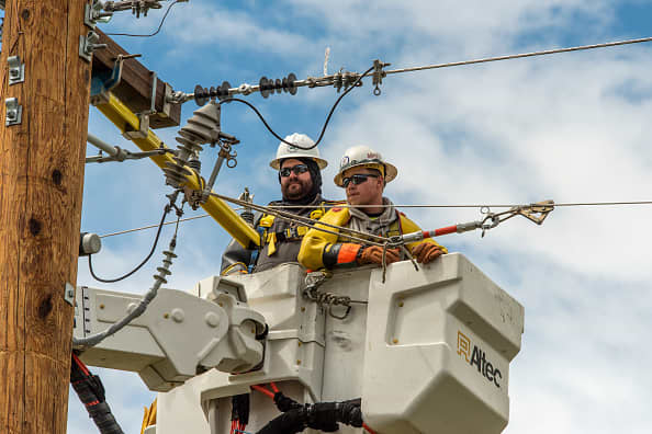 Linemen work on a rebuild of Northwestern Energy electric transmissions lines in Park County on May 14, 2020 in Livingston, Montana.
