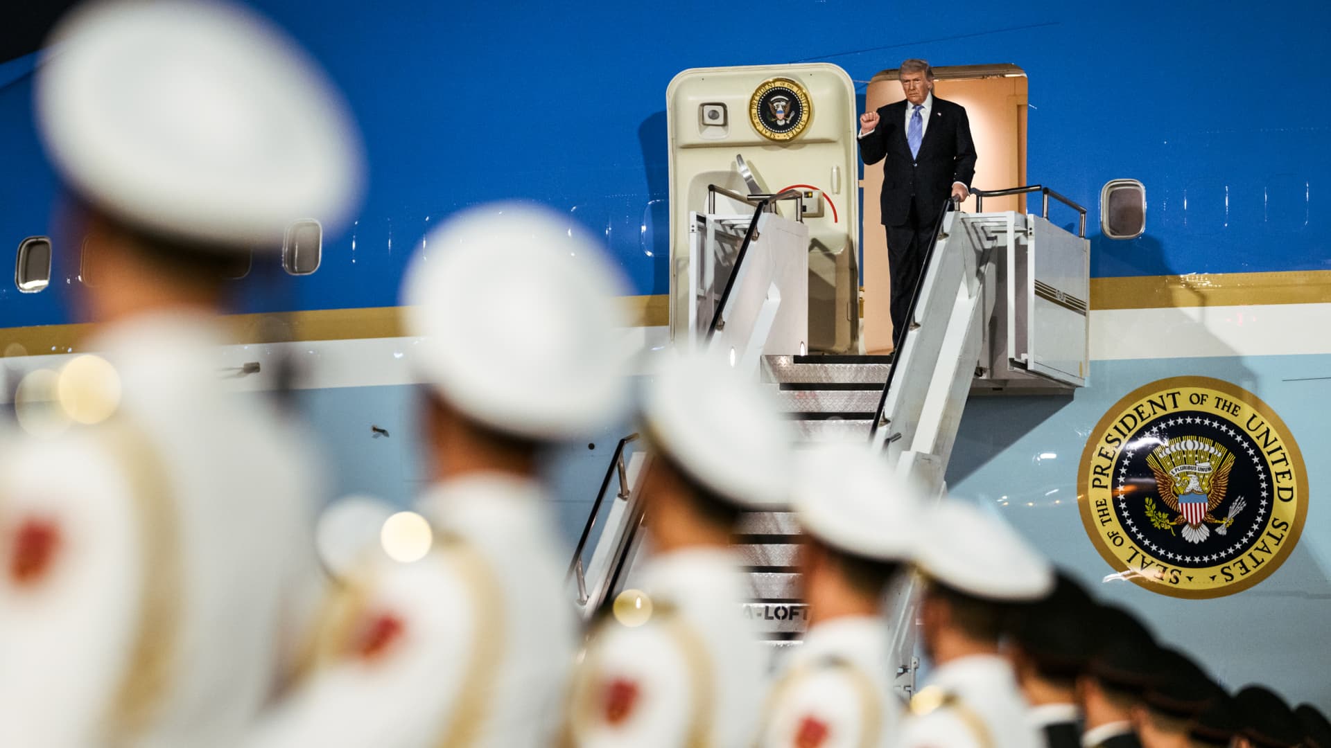 In photos: Trump lands in China ahead of high-stakes summit with Xi