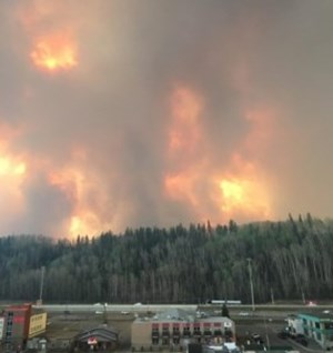 Alberta wildfires threaten oil sands production region