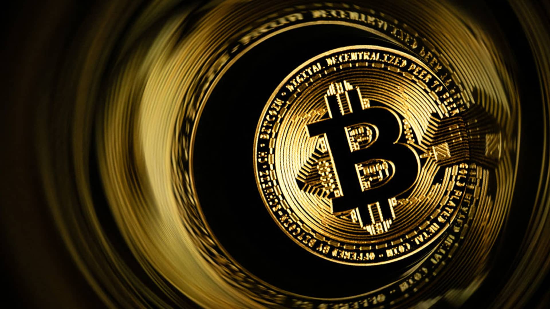 Bitcoin drops back under $70,000, Strategy extends its slide