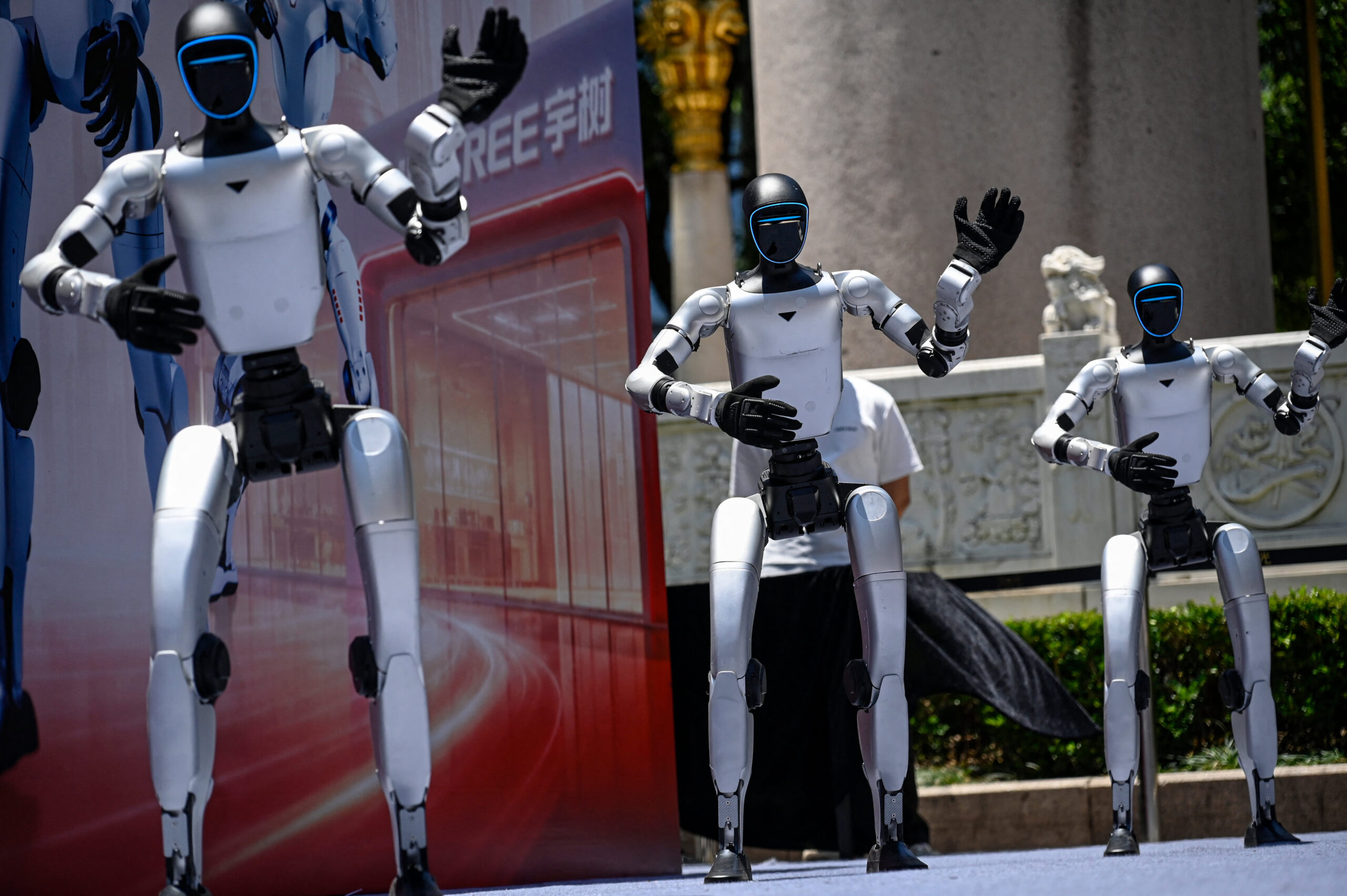 Unitree Robotics humanoids dance on May 31, 2026, in Shanghai, for the opening of Asia's first embodied intelligence experience store.