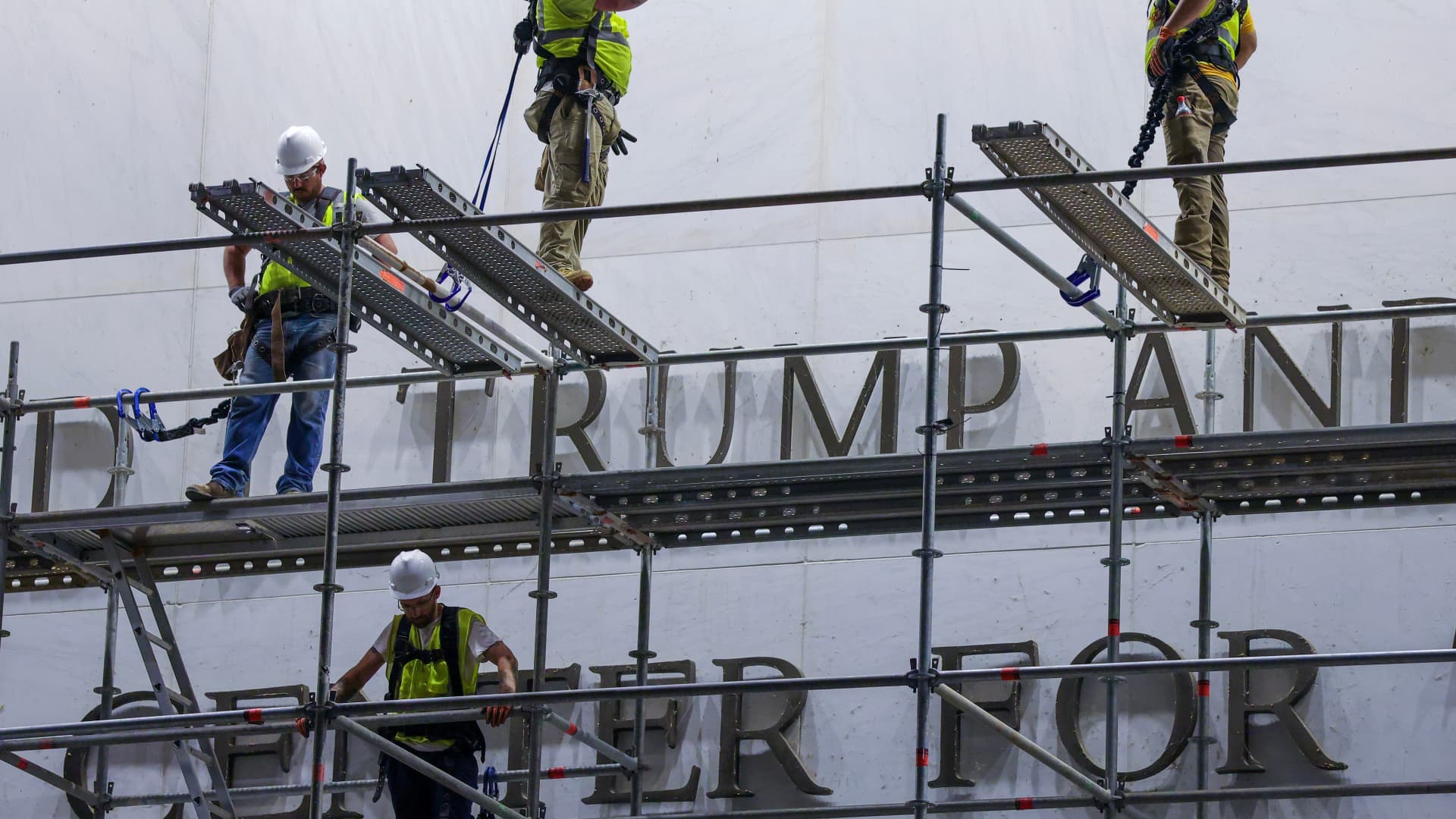 Workers begin removing Trump's name from the Kennedy Center, hours after a court-ordered deadline