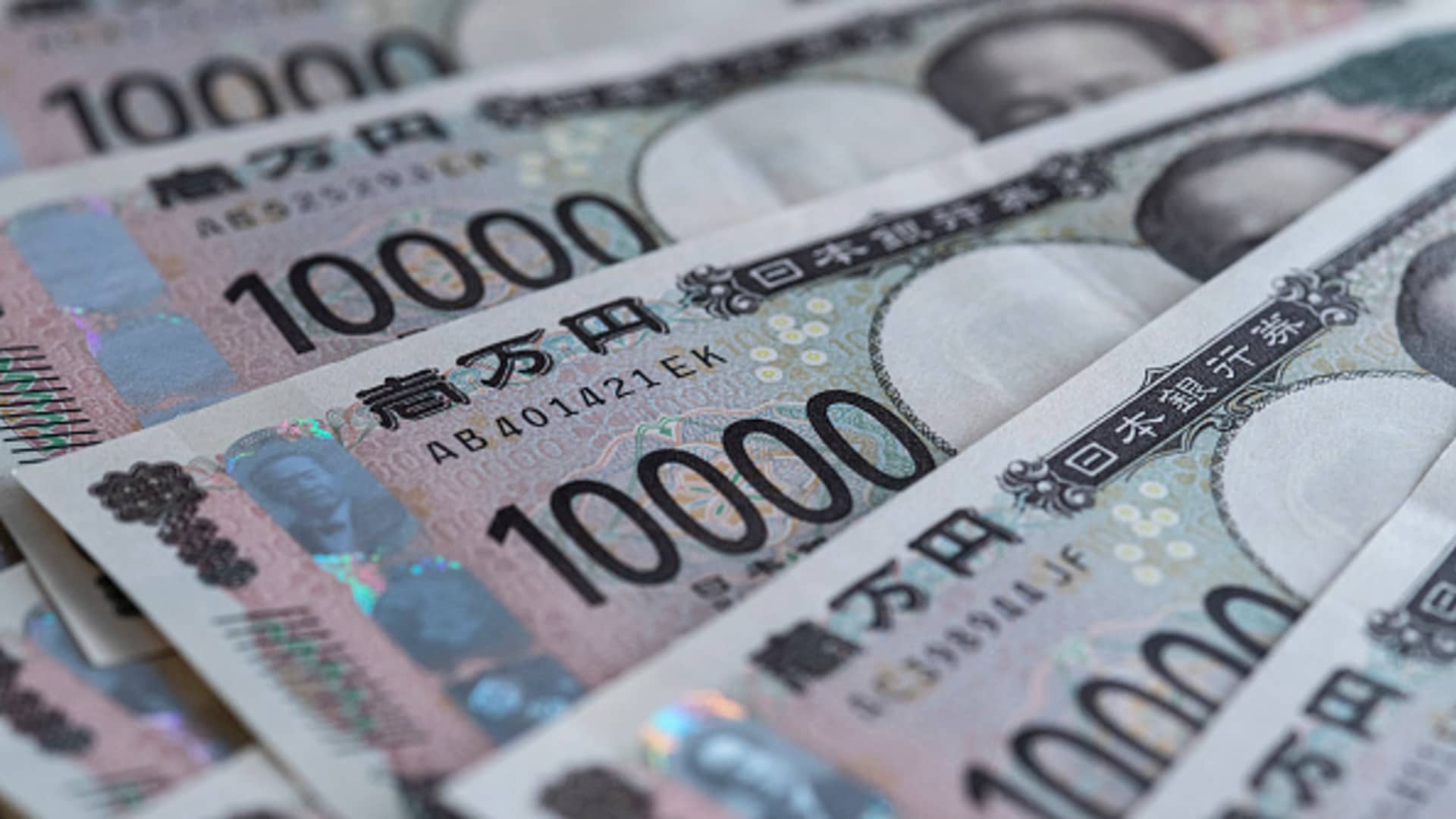 Dollar near two-week lows as rate-hike bets recede, embattled yen in focus