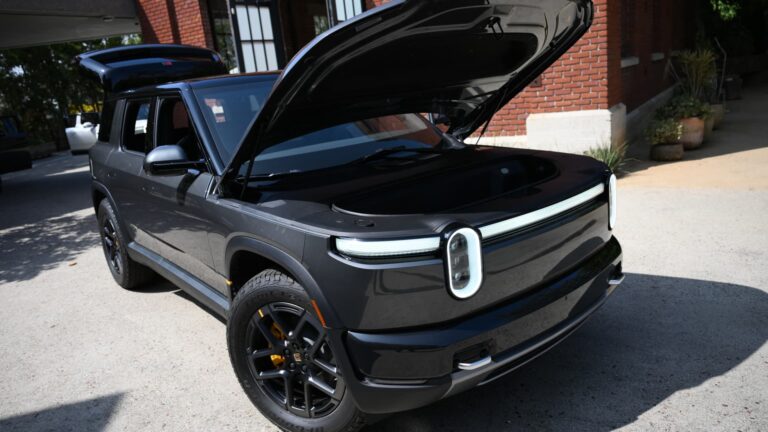 Stocks making the biggest moves midday: Rivian, Tesla, Sandisk, Blue Owl, AeroVironment & more