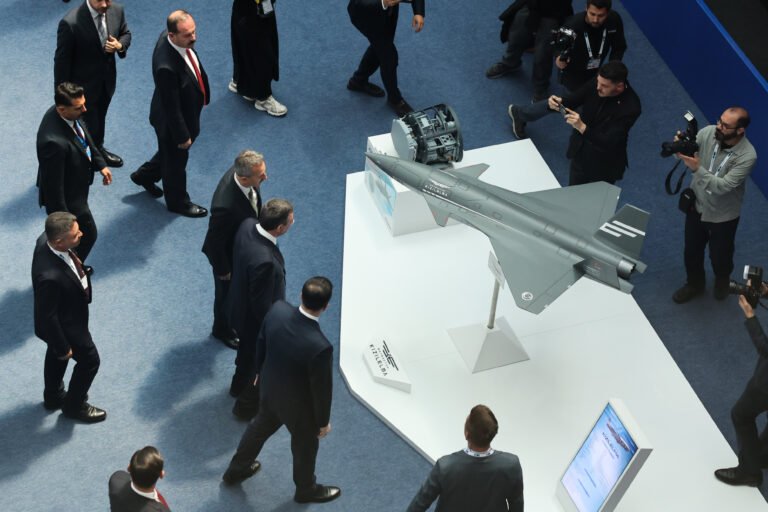 Turkish Vice President Cevdet Yilmaz looks on a model of Bayraktar drone during the Defence Industry Forum at the NATO Summit in Ankara, Turkiye on July 7, 2026.