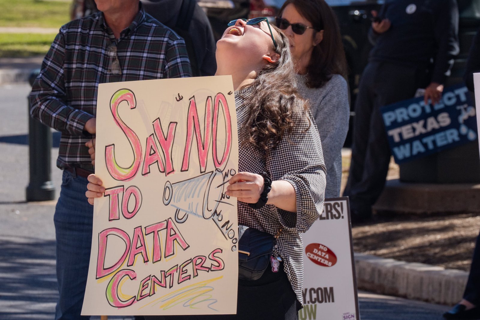 Advocacy groups and community members protest laws surrounding data centers while outside the Texas Capitol in Austin Monday, Feb. 23, 2026.