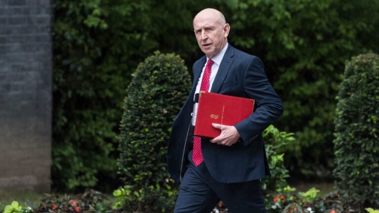 The UK cuts energy bills, taxes banks and boosts defense in high-stakes budget