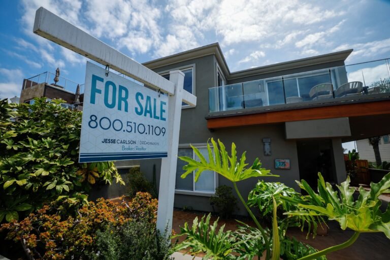 A "For Sale" sign outside a single-family home in Carlsbad, California, U.S., Sept. 16, 2026.