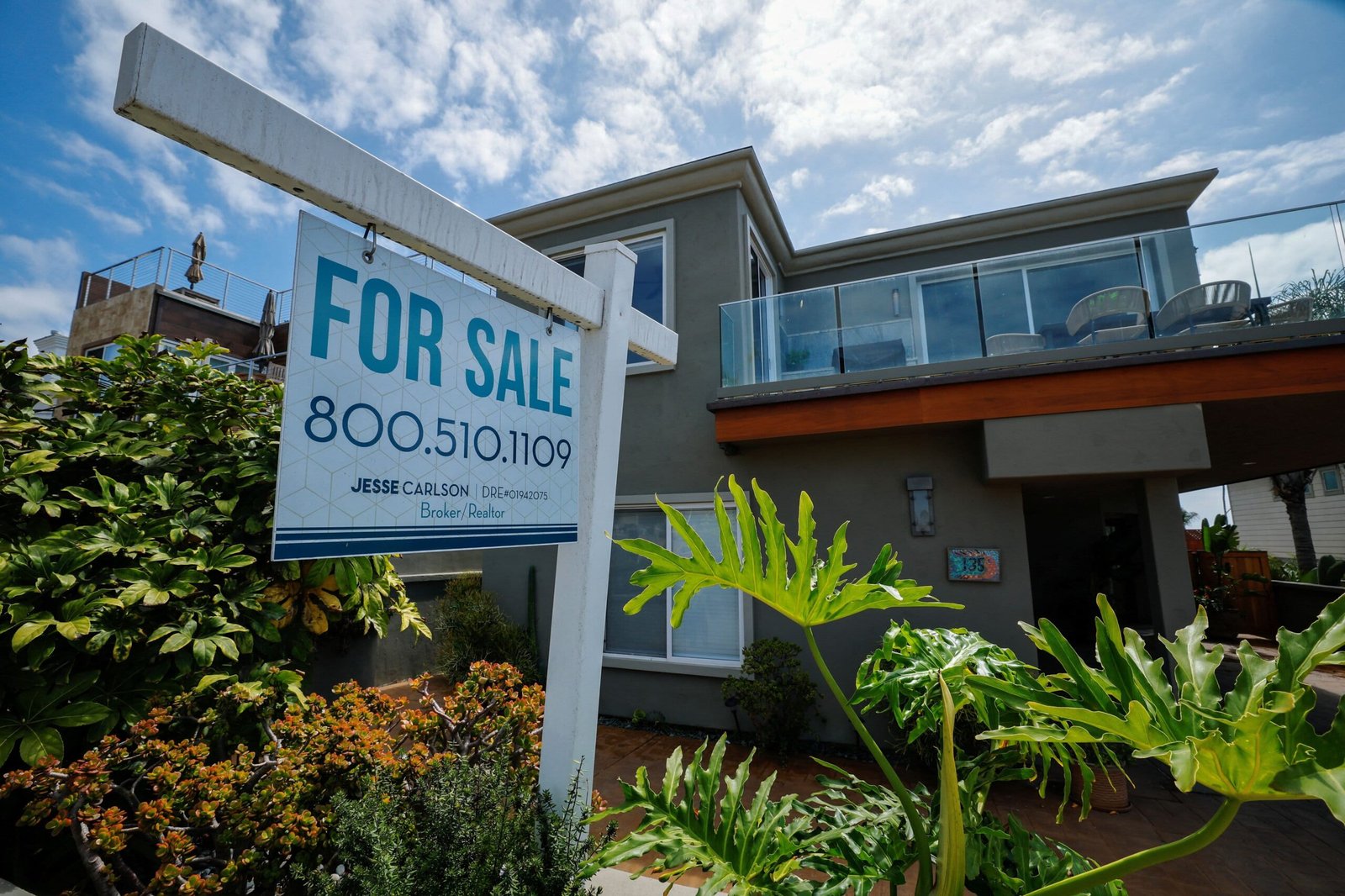 A "For Sale" sign outside a single-family home in Carlsbad, California, U.S., Sept. 16, 2026.