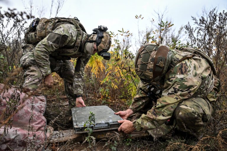 Soldiers from a separate task rifle battalion of the National Police of Ukraine in the Zaporizhzhia region set up a Starlink satellite communication terminal at a combat position in the Donetsk region, Ukraine, Oct. 16, 2026.
