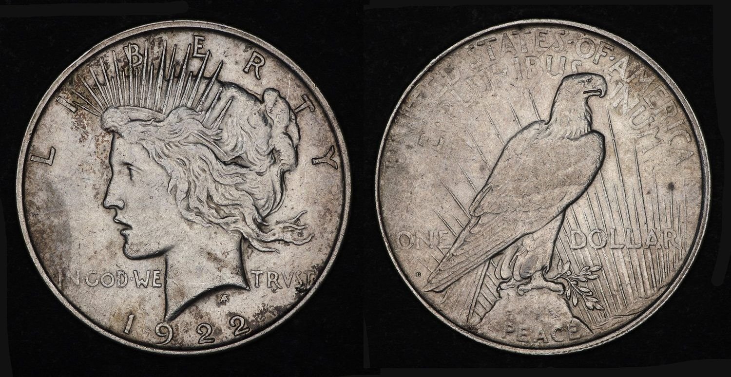 Obverse and reverse of a 1922-D Peace silver dollar, showing Liberty in left profile with a radiate crown and the eagle at rest on a rock